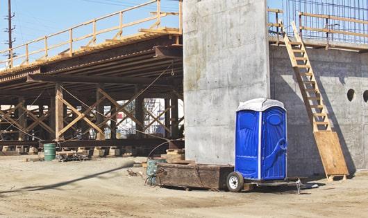 multiple portable toilets arranged for easy access at a construction site