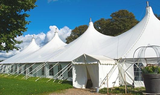 a line of sleek and modern portable toilets ready for use at an upscale corporate event in Saratoga Springs